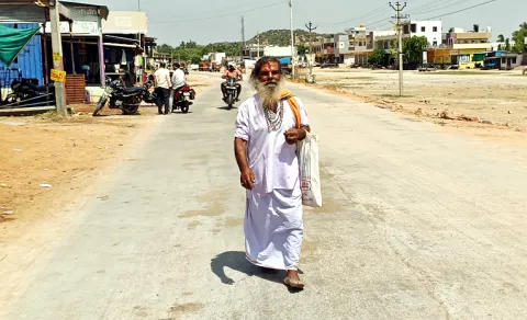 65 year old man walks barefoot in extreme heat andhra pradesh