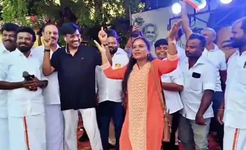Minister Viswanathan dances at a student marathon event,