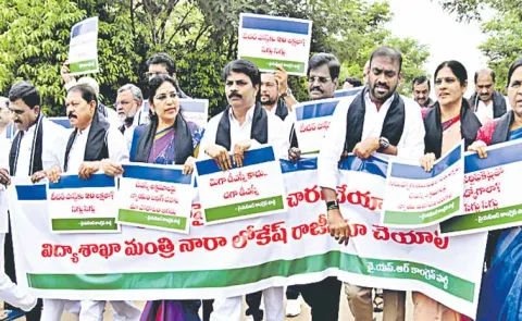 Opposition MLCs march into the council chamber and displaying placards