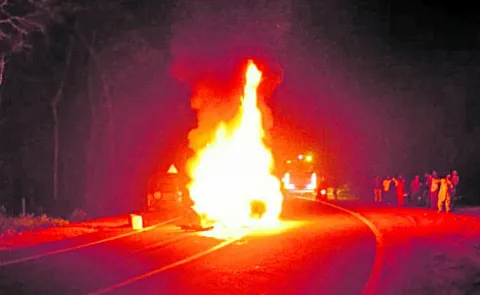 Two killed as car hits lorry catches fire
