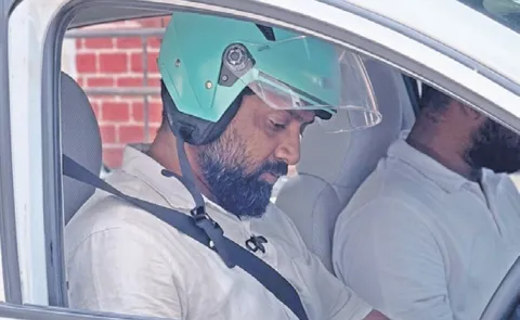 Man Drives Car Wearing Helmet After Being Fined For Not Wearing