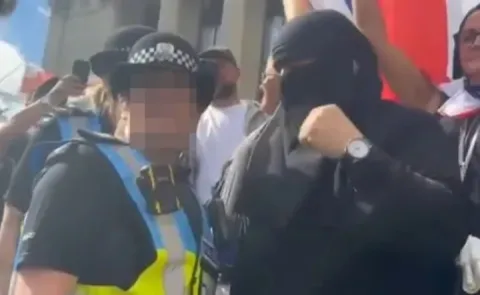  Man charged after wearing burkha to anti migrant protest  8