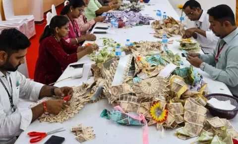 cash gold silver spill out Scenes at Lalbaugcha Raja