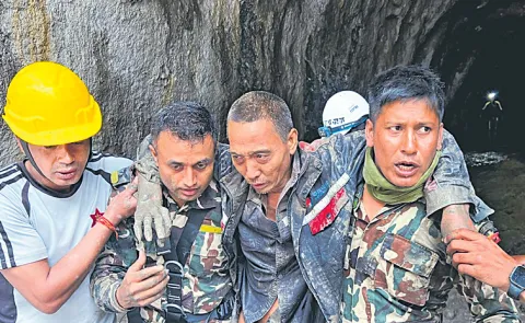 Rescuers pull Chinese worker, Nepali woman from flood wreckage alive7