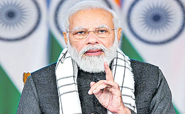 PM Narendra Modi asks districts to set time-bound targets for govt - Sakshi