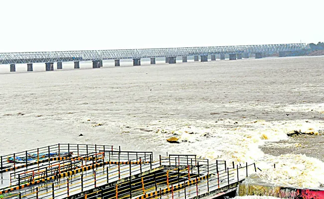 Rising flood elevation at Prakasam Barrage - Sakshi