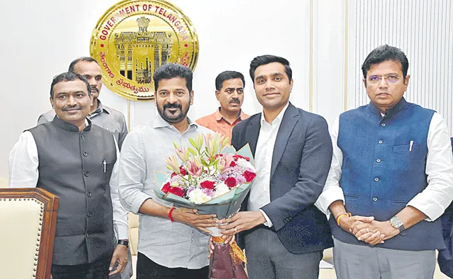 Representatives of Adani Group in a meeting with CM Revanth Reddy - Sakshi