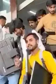 Locals Looting Laptops After Raid At Fake Chinese Call Centre In Islamabad7