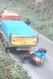 Kerala woman on scooter escapes death by a whisker as truck rolls backwards7