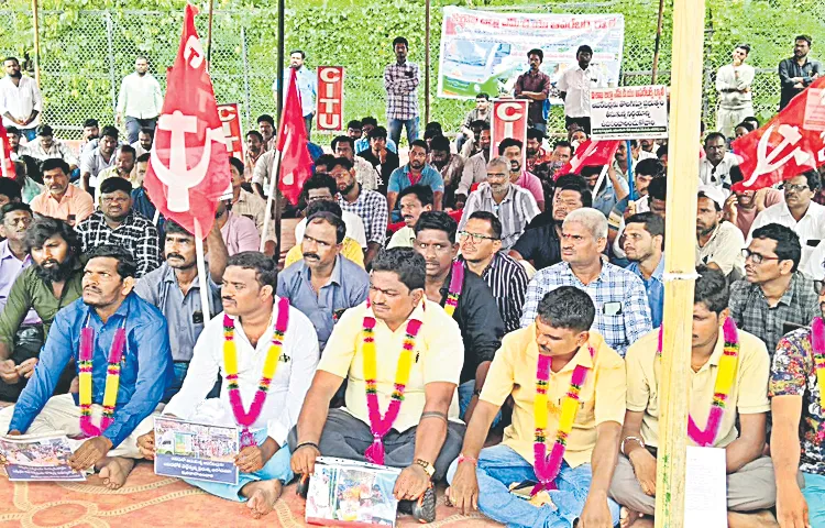 Ration vehicle drivers protest at Vijayawada Chowk for second day