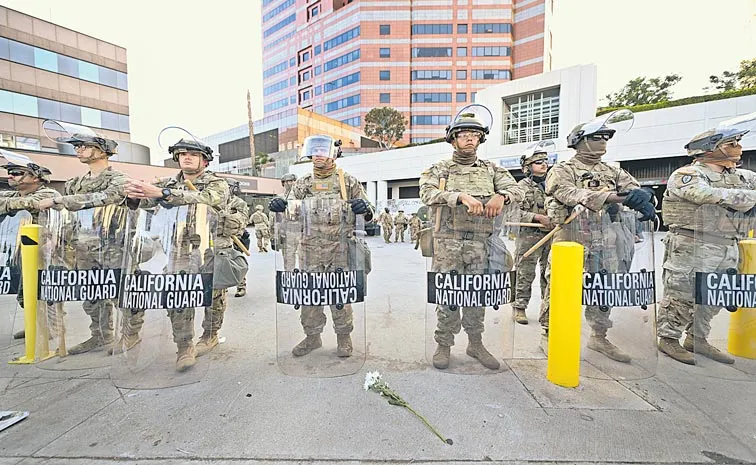 Protests against immigration raids spread across US