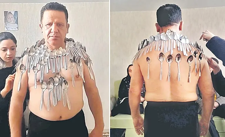 Man balances 96 spoons on body to break own record