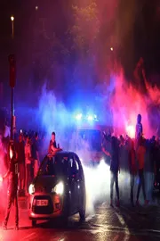 Two fans dead and police officer left in coma as violence erupts in Paris3