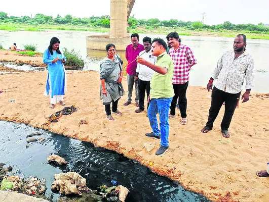 Officials observing the Penna pollution