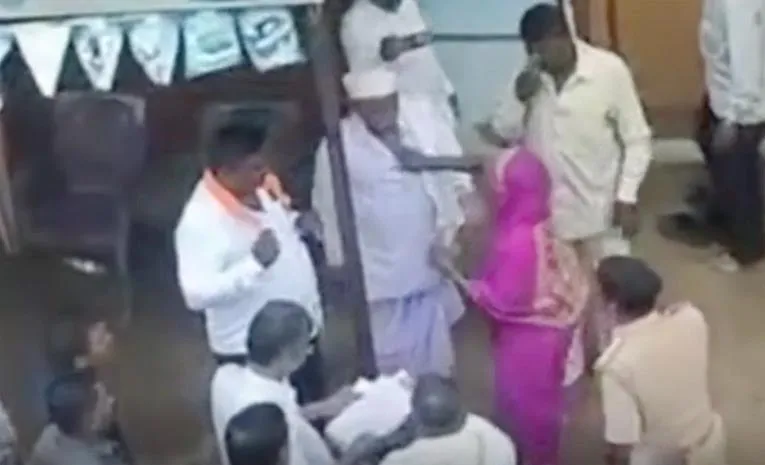 women drags husband infront of jarkiholi for ditching
