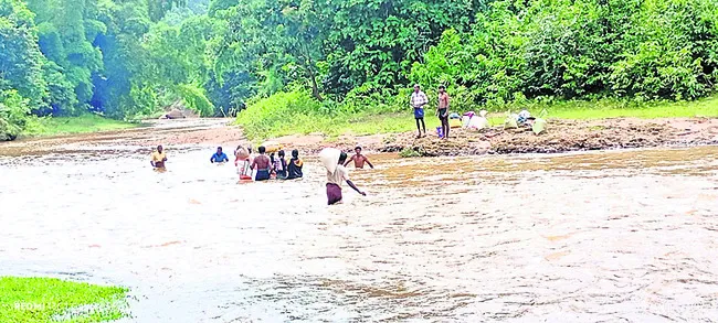 వాగు దాటితేనే రేషన్ దక్కేది!