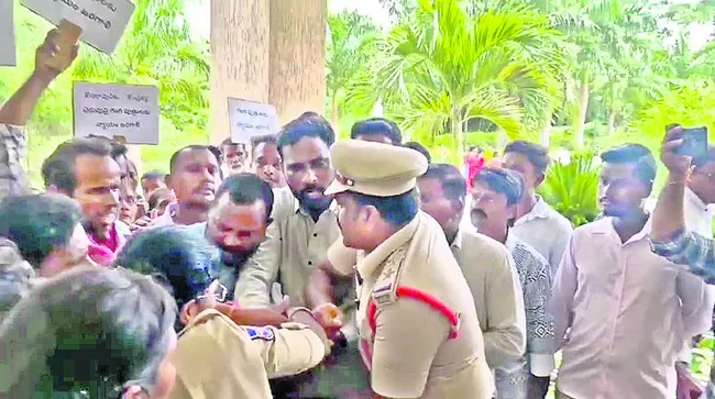 పెట్రోల్‌ బాటిళ్లతో ప్రజావాణికి..
