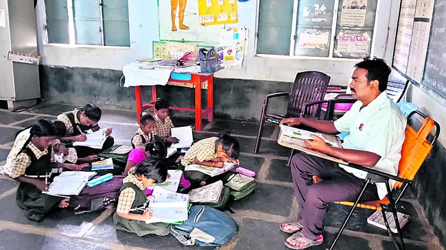 Teacher Narasimha Raju Teaching lessons to students