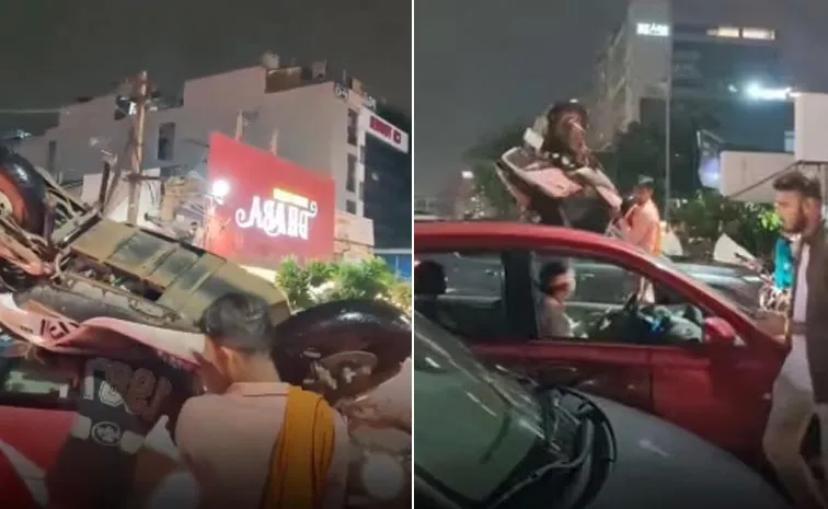 New Bahubali: Men Carry Scooter On Their Shoulders To Avoid Traffic Jam