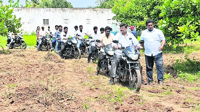 Fans escape police and ride bikes through mango orchards near Kotavuratla Mandal city