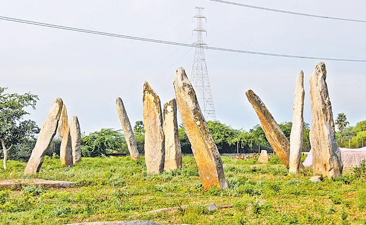 Power grid towers in the courtyard of the prehistoric monuments in Mudumaal