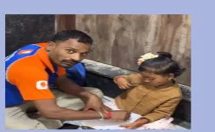 Swiggy delivery partner sitting near a building elevator