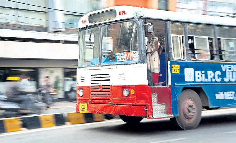 city buses crowded with women passengers