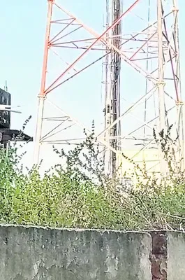 ఇంటి స్థలం కోసం టవరెక్కి నిరసన