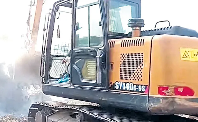 Demolition of compound wall of Karivena Satram in Srisailam