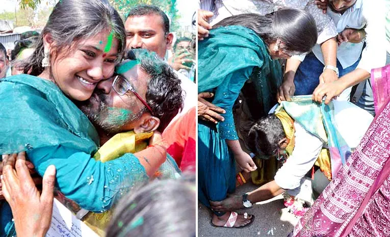 father touches daughters feet after winning municipal election