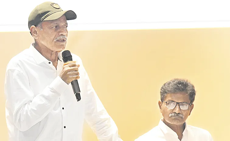 Devji and Malla Rajireddy with the media after surrender