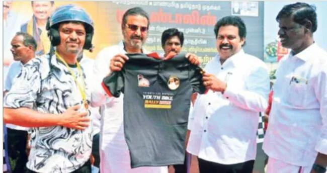 Actor Mohan Babu and MLAs presenting T-shirts who participated in the rally.