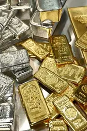 Silver Falls for Third Day Gold Edges Higher