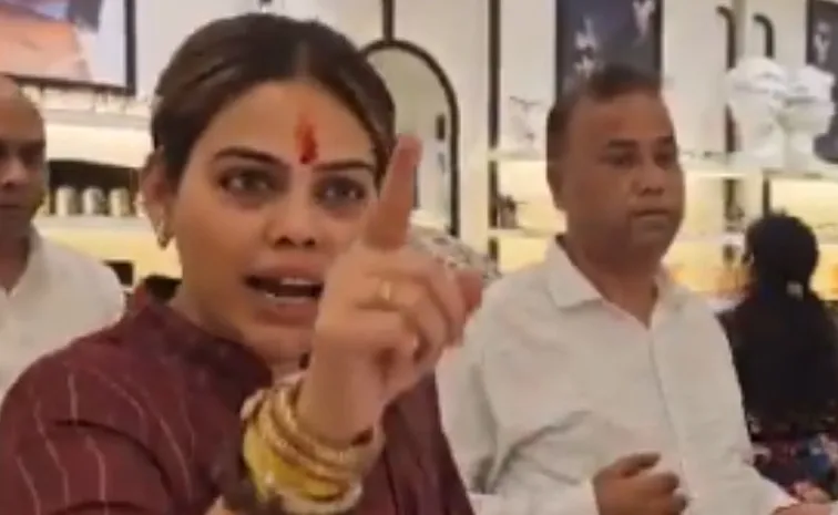  This Is  Hindu Nation BJP Leader Storms Lenskart Store Applies Tilak To Staff