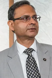 RBI Governor Malhotra Stresses Wait and Watch Policy Global Tensions