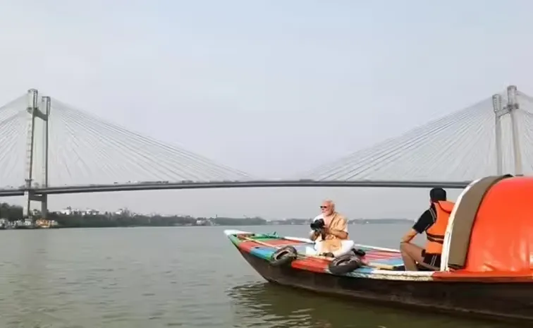 PM Modi boat ride with camera in hand, shares Hooghly pictures