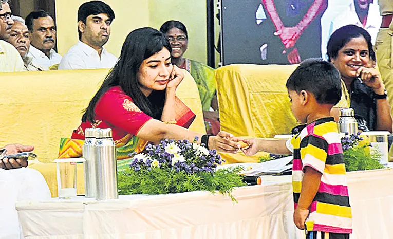Collector Garima Agrawal Gives Biscuit To A Kid