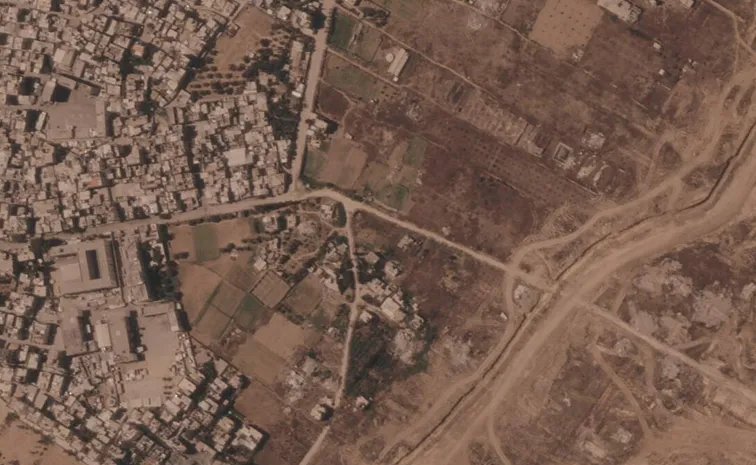 Israel is building a miles-long earthen barrier inside Gaza