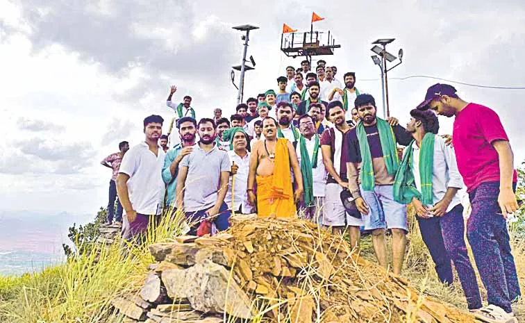 Devotees climb Sadhukonda to protest mining