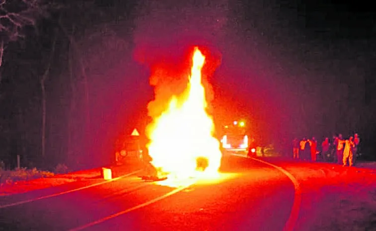 Two killed as car hits lorry catches fire