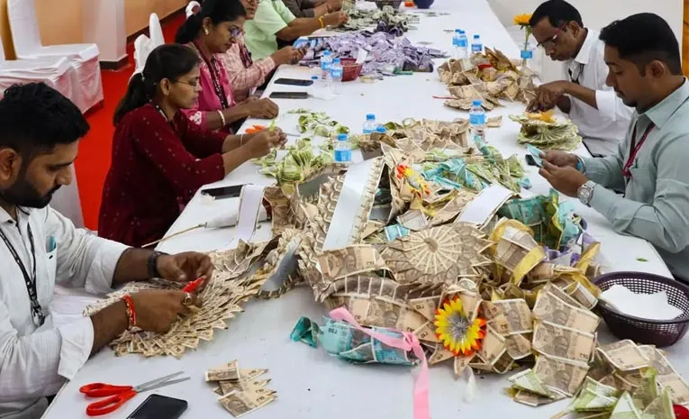 cash gold silver spill out Scenes at Lalbaugcha Raja