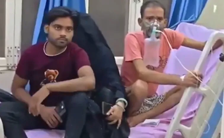 కాటేసిన పాముతో ఆసుపత్రికి : పాము హల్‌చల్‌, వణికిన రోగులు 