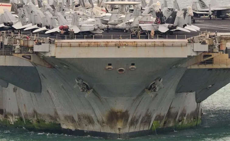 After Months Uss Abraham Lincoln Limps Into Port Covered In Rust