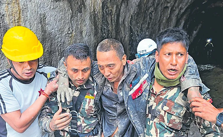 Rescuers pull Chinese worker, Nepali woman from flood wreckage alive