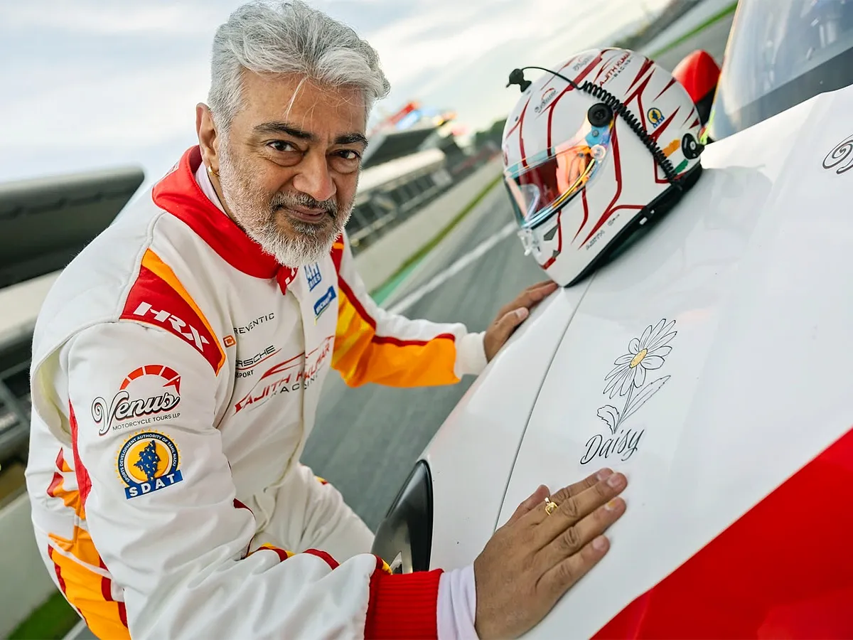 Ajith Kumar Poses with His Race Car At Barcelona F1 Circuit
